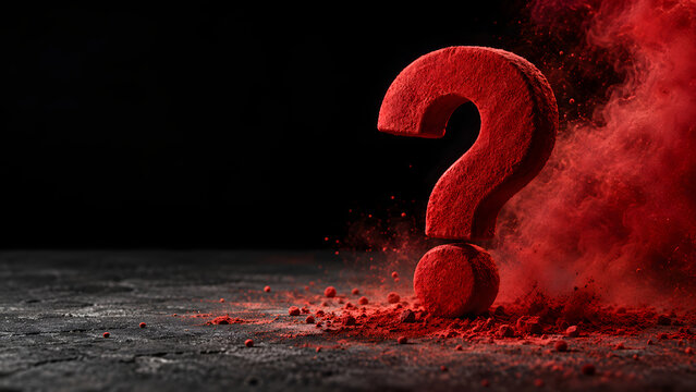 Red question mark made of powder with exploding dust cloud on dark concrete surface and black background with copy space