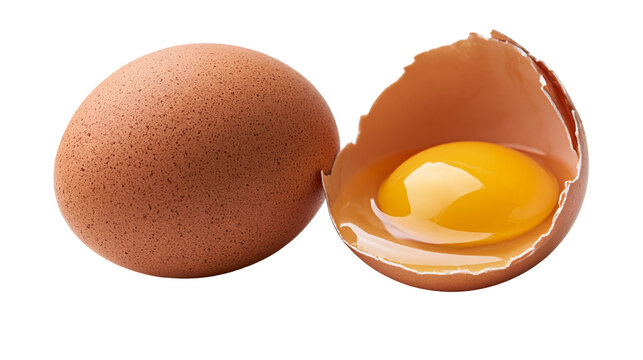 Whole brown chicken egg next to a cracked eggshell with a bright yellow yolk