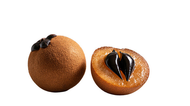 Whole and halved sapodilla fruit with shiny black seeds and brown textured skin