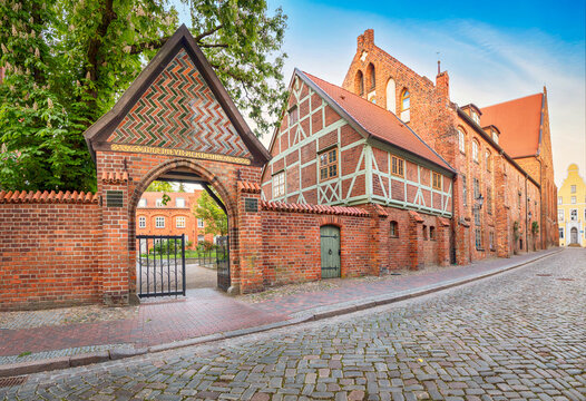 Historic Heiligen-Geist-Hospital and Heiligen-Geist-Kirche complex in the old town of Wismar, Germany, featuring traditional North German red brick architecture