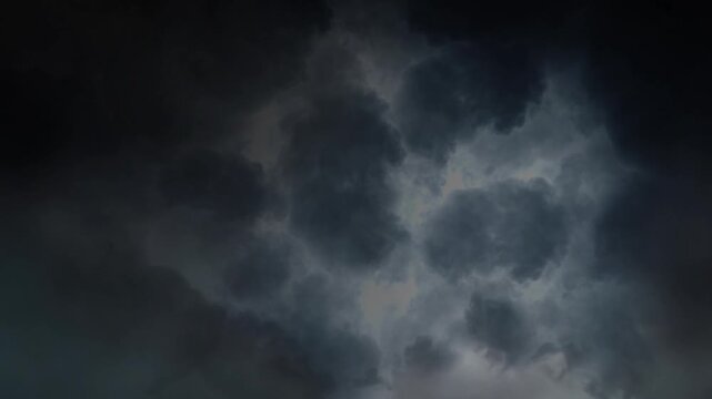 Dark Thunderclouds Illuminated by Distant Lightning