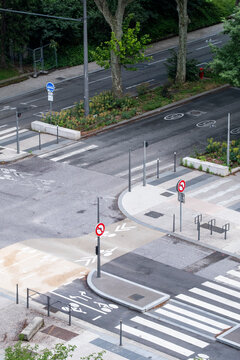 Elevated view of an urban intersection with bicycle lanes crossings and road markings showing mobility infrastructure and street planning