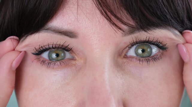 The woman has a drooping eyelid
