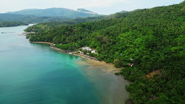 Aerial view of Sula Barangay and Multi-Purpose Hall in Cagraray, Albay, surrounded by tropical vegetation and the rural community landscape of Cagraray Island.