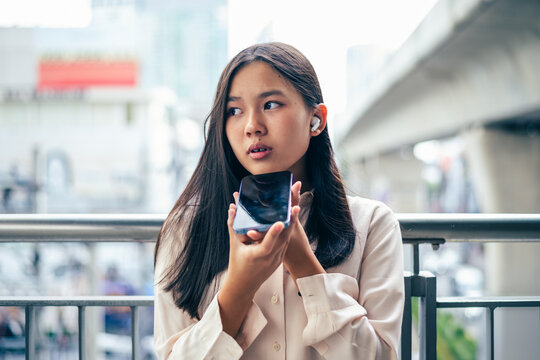 woman talking and command an AI voice assistant on a smartphone as a conceptual backdrop for artificial intelligence technology communication phone innovation virtual assistant and smart lifestyle