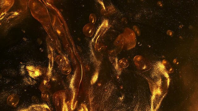 Super Slow Motion Shot of Swirling Golden Glittering Oil in Water at 1000fps.