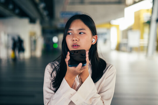 woman talking and command an AI voice assistant on a smartphone as a conceptual backdrop for artificial intelligence technology communication phone innovation virtual assistant and smart lifestyle