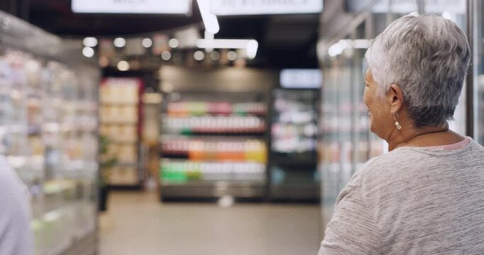 Supermarket, store assistant and old woman with help, groceries and service with consumer support. Question, guidance and person with pensioner for customer experience, direction and aisle in shop