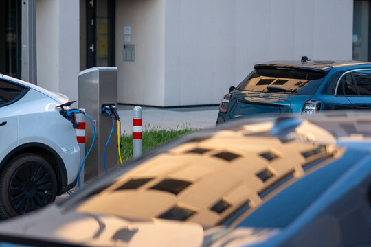 Electric vehicle charging beside modern buildings in Nordbahnviertel Vienna Austria showing everyday mobility infrastructure within a contemporary neighborhood