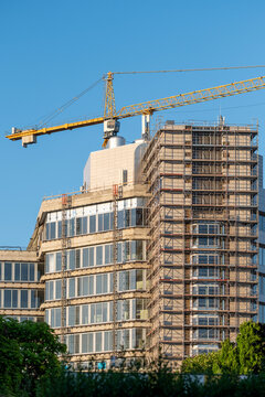 Construction crane above a modern high rise development in Nordbahnviertel Vienna Austria showing ongoing residential growth in a changing urban district