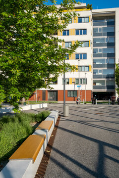 Landscaped public space with benches trees and tram tracks in Nordbahnviertel Vienna Austria showing green urban design within a modern residential district