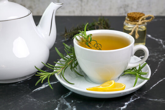 rosemary tea cup of herbal rosemary tea with lemon