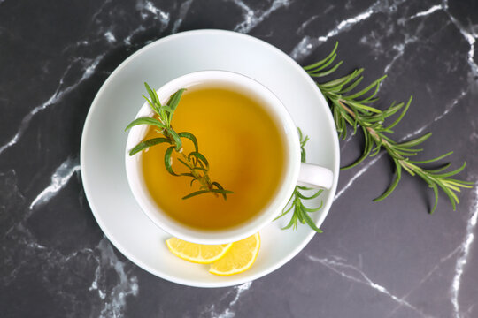 rosemary tea cup of herbal rosemary tea with lemon