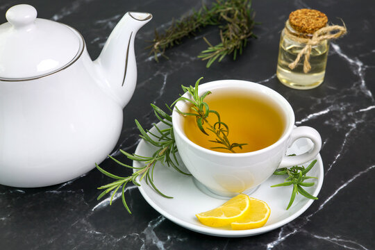 rosemary tea cup of herbal rosemary tea with lemon