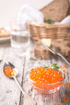Glass bowl with red caviar. Helthy food.