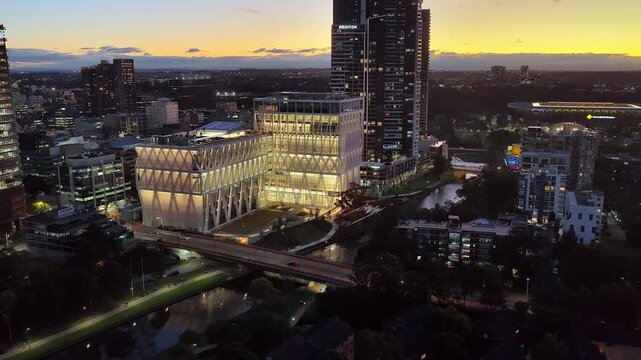 Lights of illuminated modern urban architecture in city of Parramatta, Sydney West powerhouse.