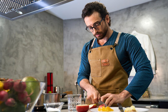 Man preparing healthy meal in modern kitchen