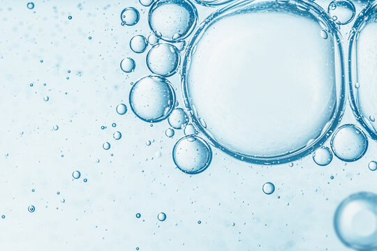 Abstract light blue water bubbles macro texture background for cosmetic serum