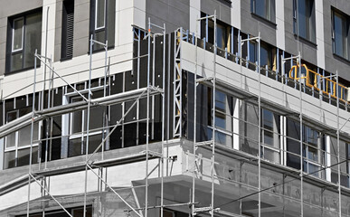 Facade cladding work and scaffolding © Unkas Photo