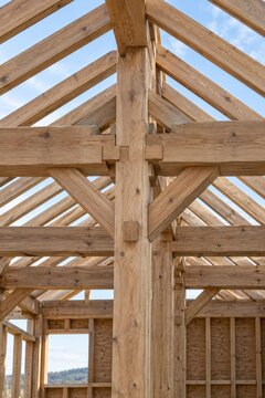Exposed timber roof frame of a building under construction