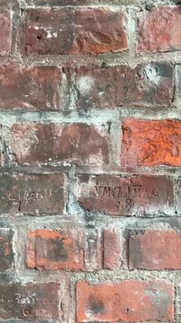 bricks background ,antique brickwork ,stamped mark ,old bricks with embossed markings, initials and name of the factory ,East Prussian bricks, texture background, 