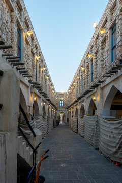 Doha, Qatar - Souq Waqif in Doha, Qatar, showcasing its traditional Qatari architecture, narrow pathways, heritage buildings, shops, and vibrant atmosphere. 