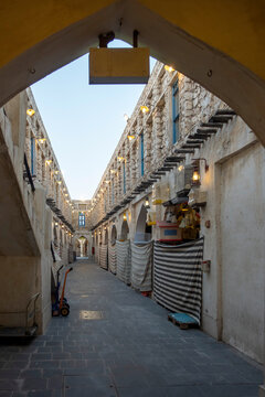 Doha, Qatar - Souq Waqif in Doha, Qatar, showcasing its traditional Qatari architecture, narrow pathways, heritage buildings, shops, and vibrant atmosphere. 