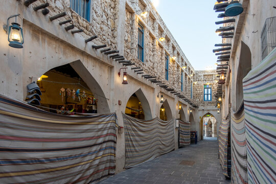Doha, Qatar - Souq Waqif in Doha, Qatar, showcasing its traditional Qatari architecture, narrow pathways, heritage buildings, shops, and vibrant atmosphere. 