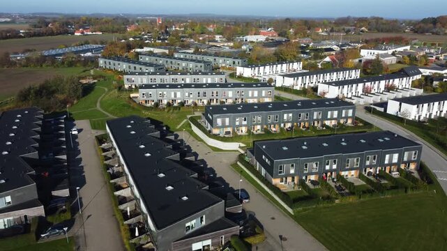 Modern residential development with rows of homes at Gammel Ega near Aarhus, Denmark, aerial
