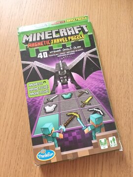 Minecraft magnetic travel puzzle game box featuring an ender dragon and pixelated game items