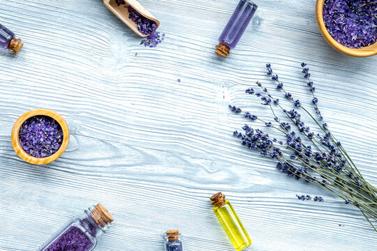 organic cosmetics with lavender on wooden background top view