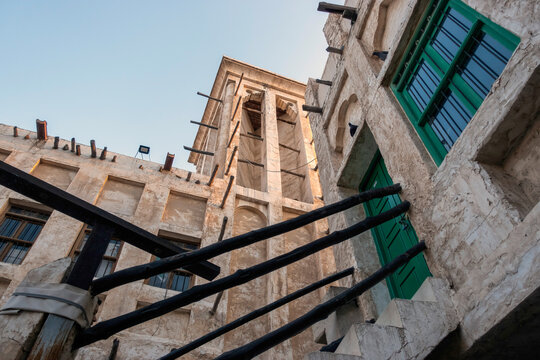Doha, Qatar - Souq Waqif in Doha, Qatar, showcasing its traditional Qatari architecture, narrow pathways, heritage buildings, shops, and vibrant atmosphere. 