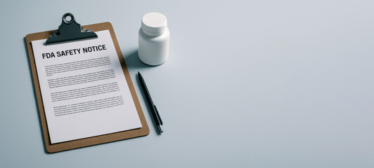 FDA Food and Drug Administration safety notice clipboard with pill bottle and pen on blue background © dvoevnore