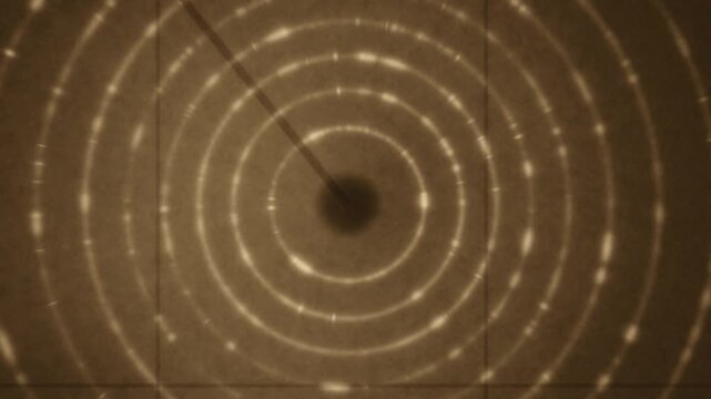 X-ray powder diffraction Debye rings rotating crystal grain texture dark detector seamless loop in subtle brown tones