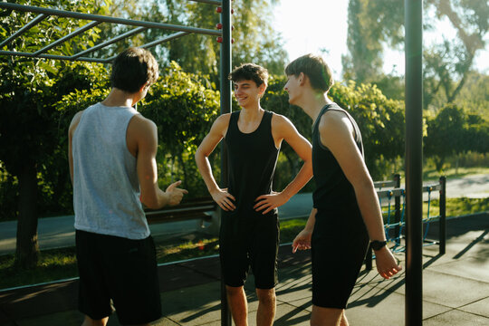 Zoomers communicating and resting at the outdoor fitness area.