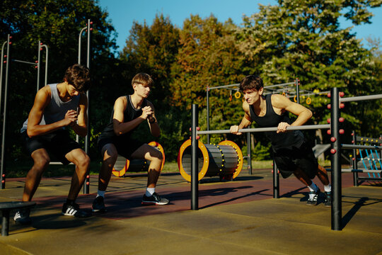 Adolescent friends participating in energetic outdoor physical activities.