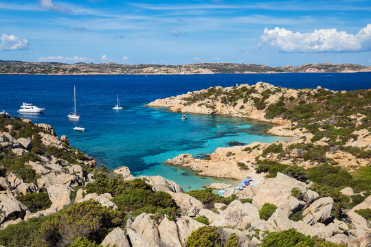 Cala Napoletana bay with boats on caprera island, corsica, italy