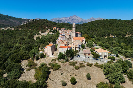 Soveria hill town in corsica france with church tower and mountains