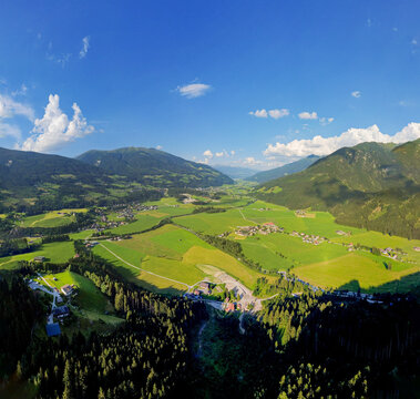 Alpine landscape in Kitzb&uuml;hel Alps, scenic aerial view of green valley and mountains in Tyrol Austria for travel and nature conservation concepts