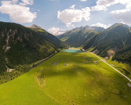 Alpine wilderness and travel destination, aerial view of Kitzb&uuml;hel Alps in Austria with mountain lake and green valley landscape in summer