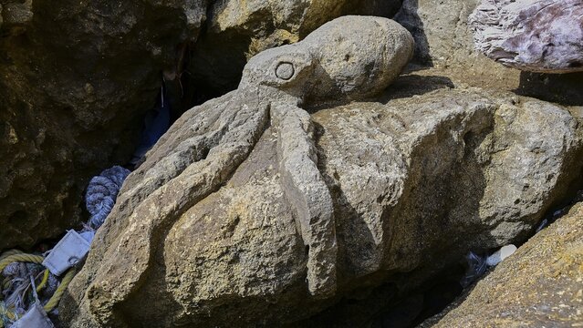 Red Beach, dream beach in the neighboring bay of Matala, stone-carved octopus lying on a rocky surface and giving a maritime impression, Matala, Neolithic caves, former hippie paradise, central south coast, Crete, Greek islands, Greece