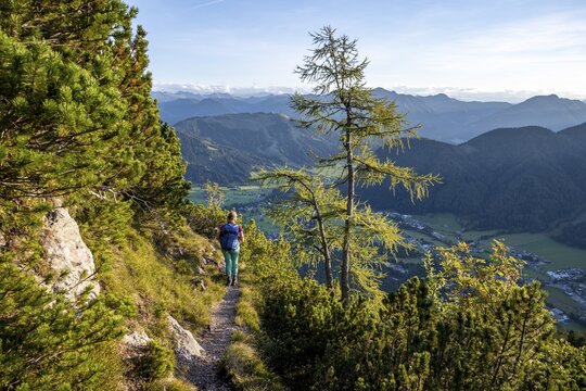 Hiker on a hiking trail, r&uuml;ne mountain landscape, Nuaracher H&ouml;henweg, Loferer Steinberge, Tyrol, Austria