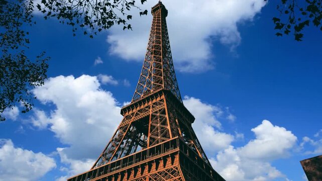 Majestic Iconic Eiffel Tower Landmark in Paris France Low Angle View.  Low angle shot of the Eiffel tower as seen from the Eiffel park.