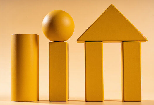 Ochre yellow geometric wooden blocks balancing on monochrome background for stability growth architectural foundation