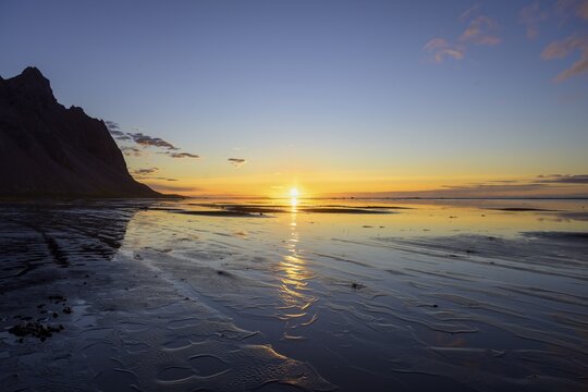 Sunrise on the beach over the sea, Vestrahorn, Klifatindur, H&ouml;fn, Austurland, Iceland