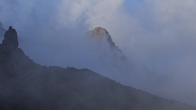 Mountain peak rising through thick fog surrounded by mysterious atmosphere, Masca, Barranco de Masca, Gorge, Teno, Teno Mountains, Northwest Tenerife, Tenerife, Canary Islands, Spain