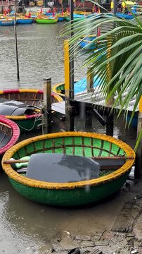 Hoi An, Da Nang, Vietnam - River Journey Through the Jungle on a Round Coconut Basket Boat, Brown River Waters, Traditional Vietnamese Hats, Overcast Rainy Weather, Authentic Round Boats, Exploring 