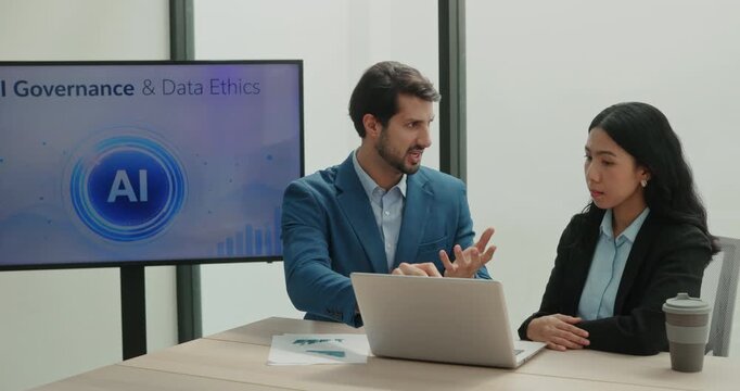 Portrait of Hispanic businessman with Asian colleague checks data with AI tools on laptop in office. Multiracial team maintains digital security of business