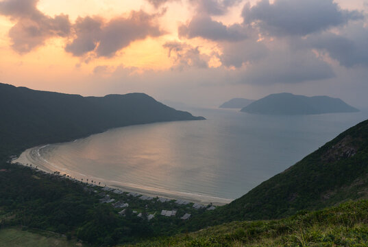 Panoramic view of Dat Doc Beach and Bay with distant islands of the Con Dao archipelago in Vietnam during a colorful sunrise