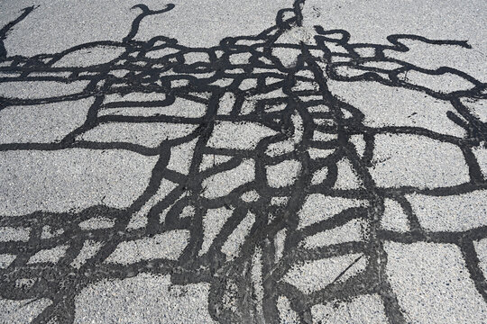 Asphalt Crack Sealing on the road.